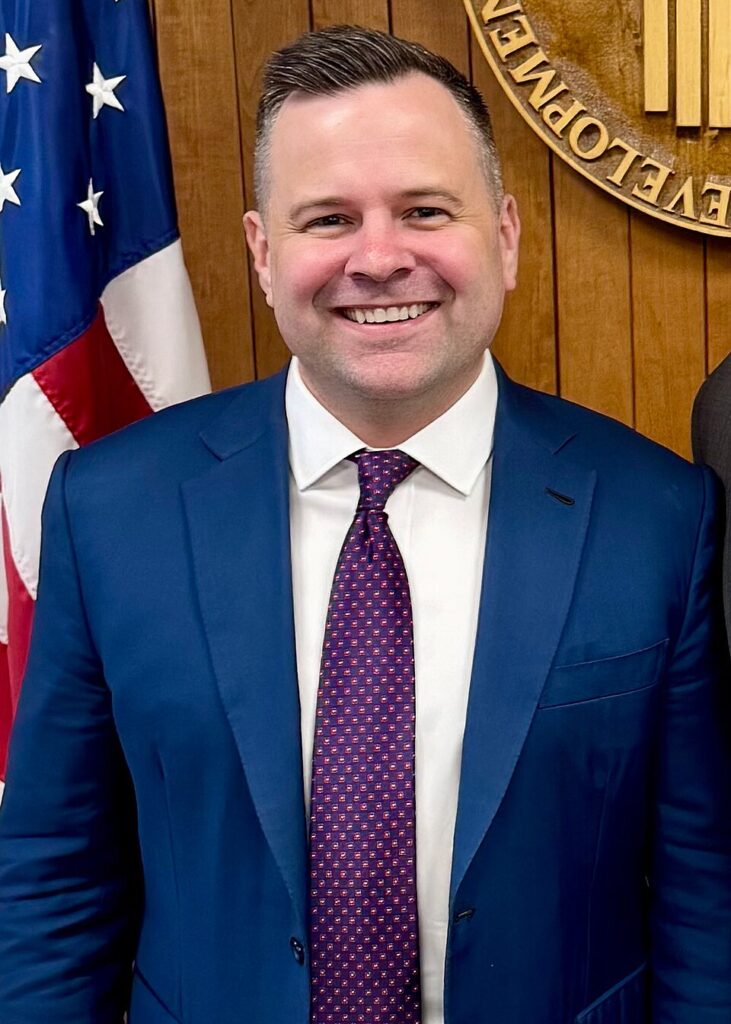 Bill Pulte, the Twitter Philanthropist, wearing a blue suit and smiling in a professional portrait.